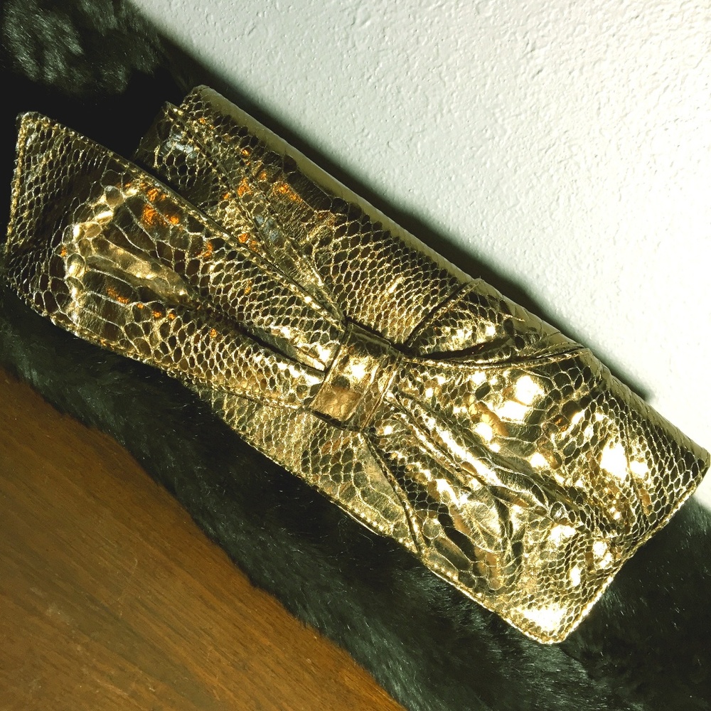Gold snakeskin textured clutch